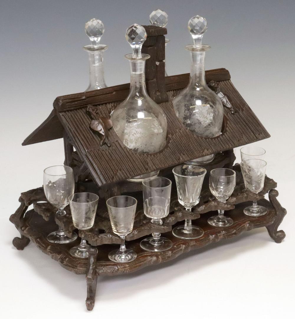 <b>Black Forest Carved Walnut Tantalus</b><br> circa late 19th cen., Continental<br> approx. 13.75 tall x 13.75 wide x 9.5 inches 